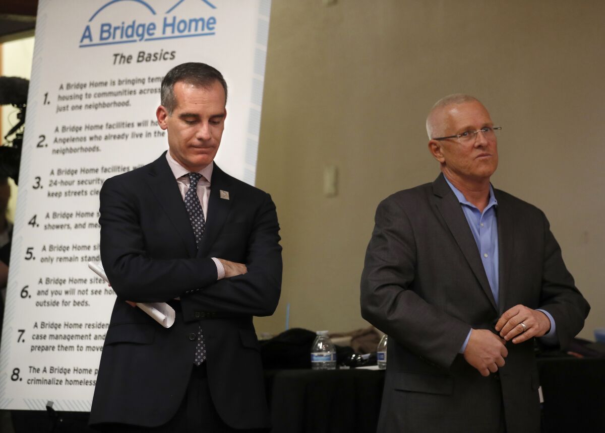 L.A. Mayor Eric Garcetti, left, and Councilman Mike Bonin at a 2018 town hall in Venice.
