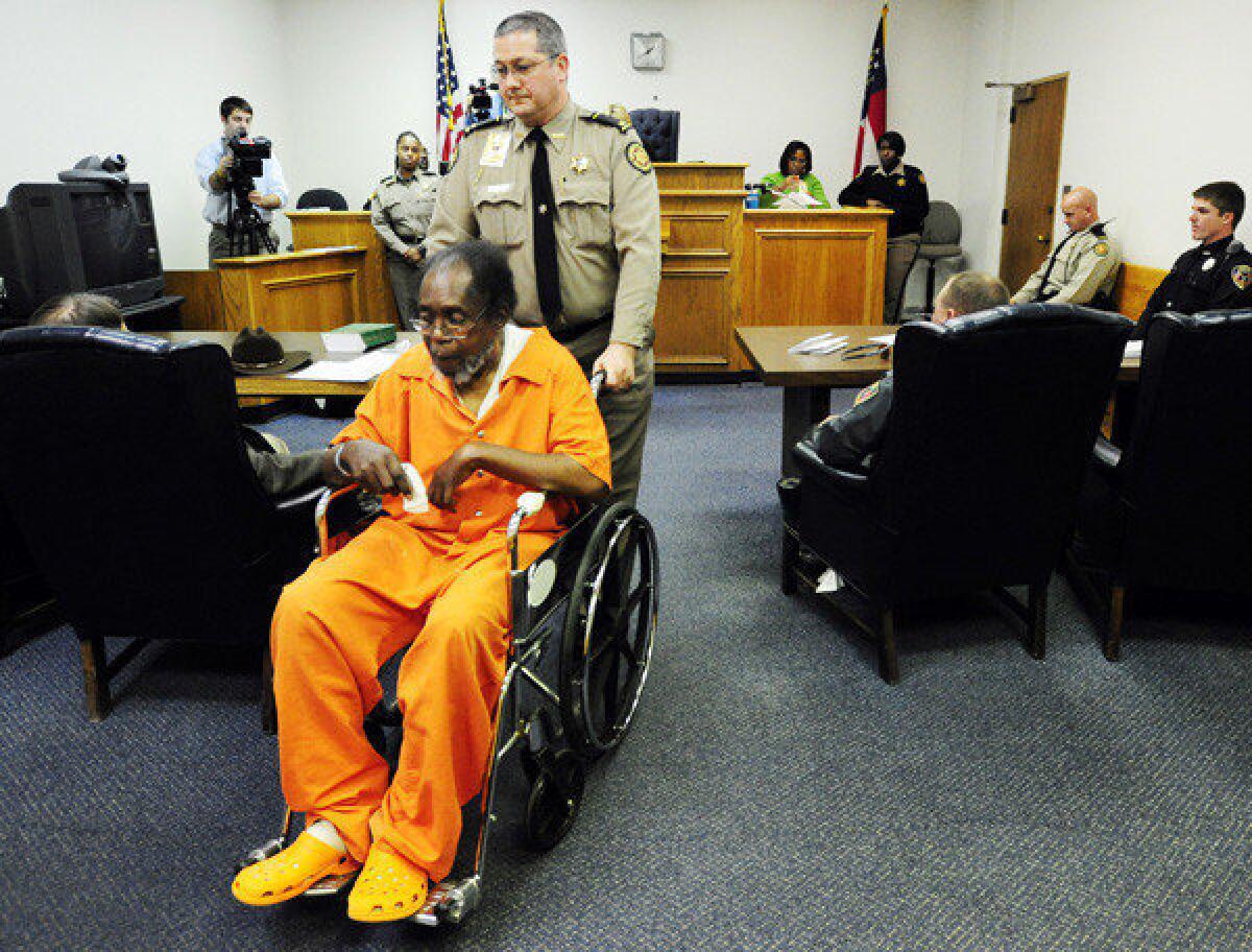 Frank Louis Reeves is wheeled out of a Macon, Ga., courtroom Wednesday.