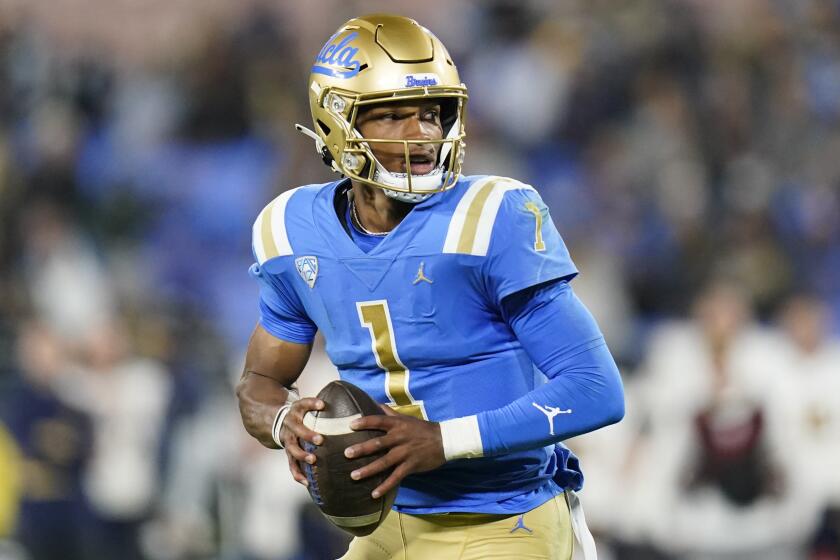 UCLA quarterback Dorian Thompson-Robinson pulls back to throw a pass during the first half of a game against California