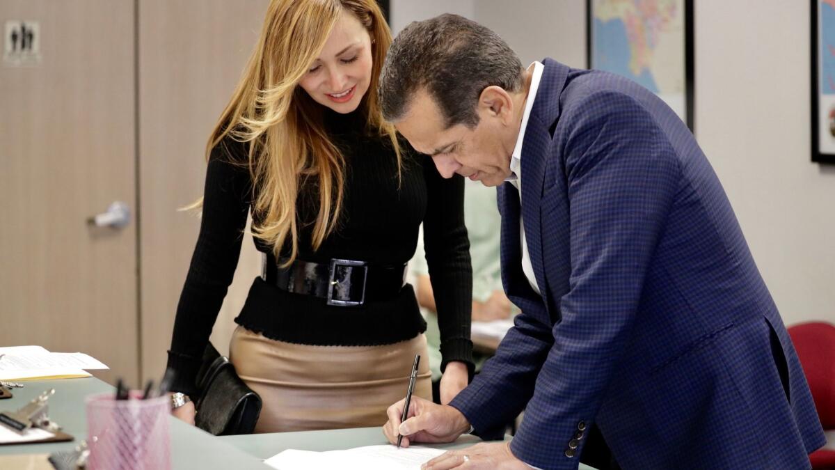 Former Los Angeles Mayor Antonio Villaraigosa, accompanied by his wife, Patty, files paperwork to officially place his name on the ballot as a candidate for governor at Los Angeles County Registrar-Recorder/County Clerk.