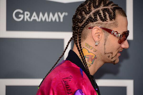 Rapper Riff Raff sports cornrows on the red carpet at the Staples Center for the 55th Grammy Awards in Los Angeles.