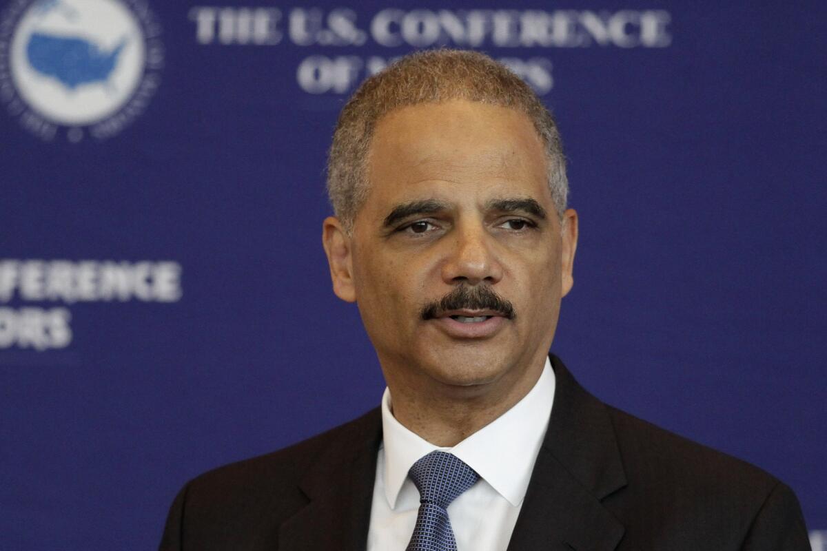 U.S. Atty. Gen. Eric Holder speaks to a meeting of the U.S. Conference of Mayors at the Clinton Presidential Library in Little Rock, Ark.