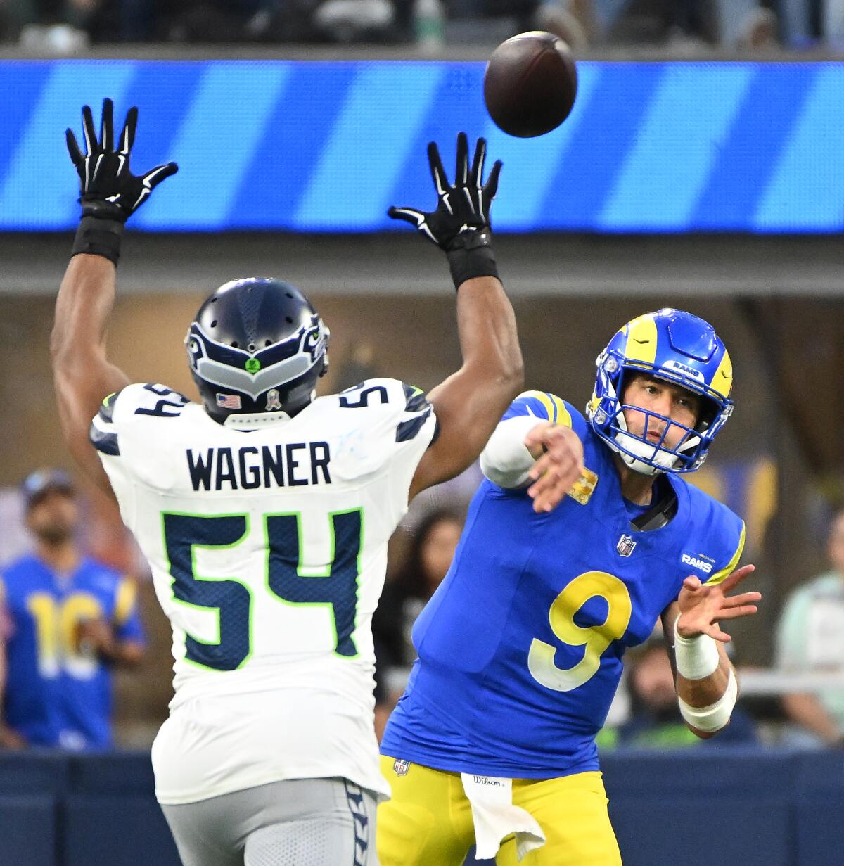 Rams quarterback Matthew Stafford throws a pass over Seahawks linebacker Bobby Wagner.