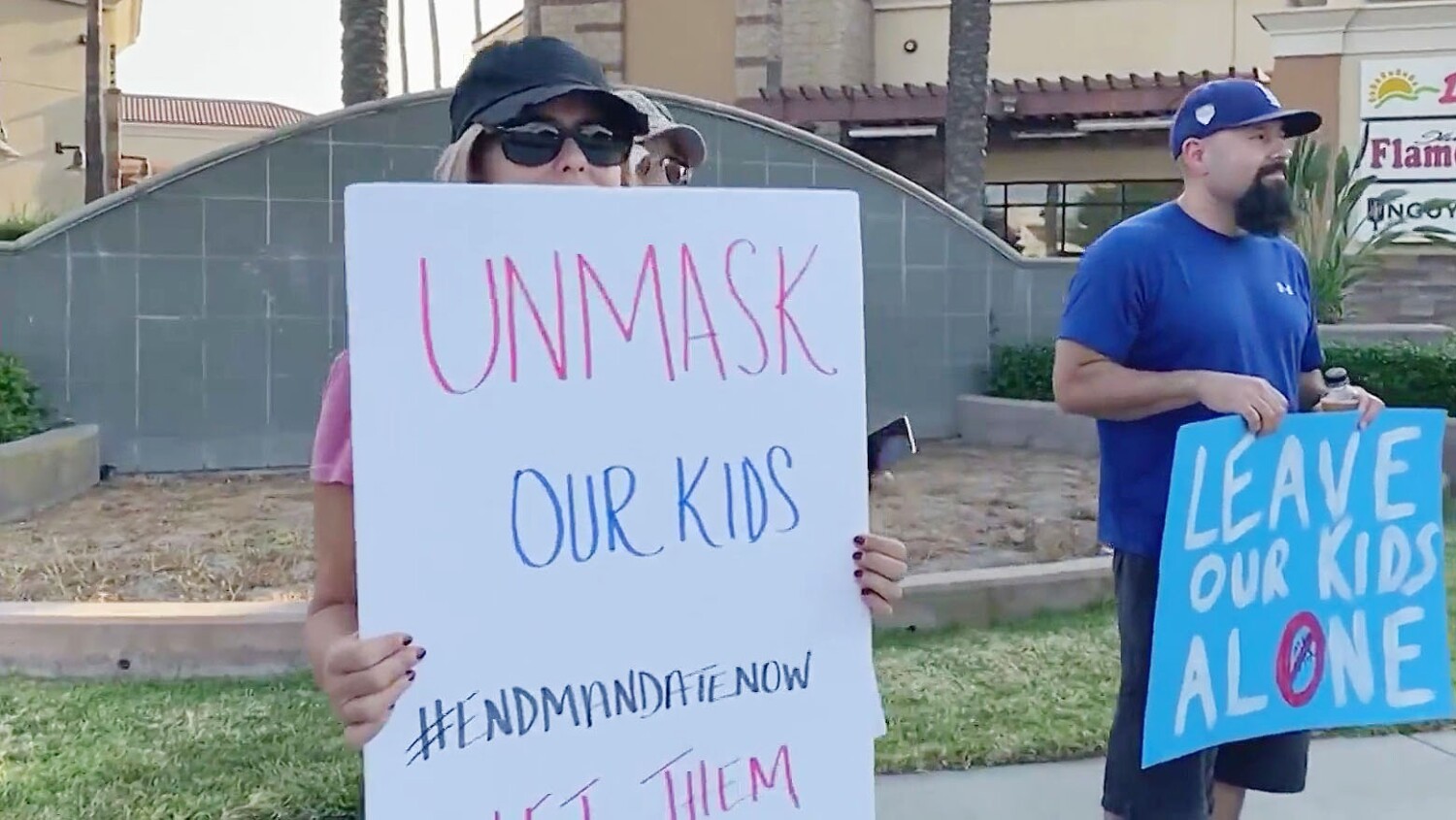 As some parents protest school mask mandates, experts urge students to keep face coverings on