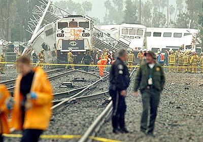 Investigators examine the wreckage from the collision of two Metrolink commuter trains in Glendale.