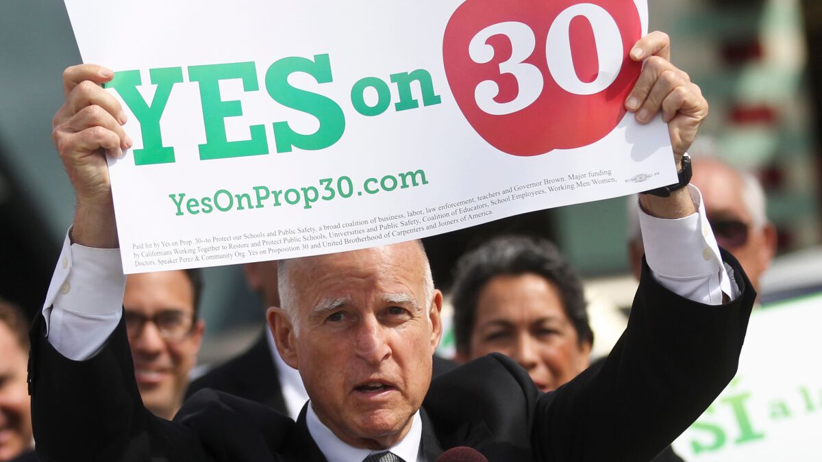 California Gov. Jerry Brown advertises his support for Proposition 30 while visiting an elementary school in San Diego in 2012.