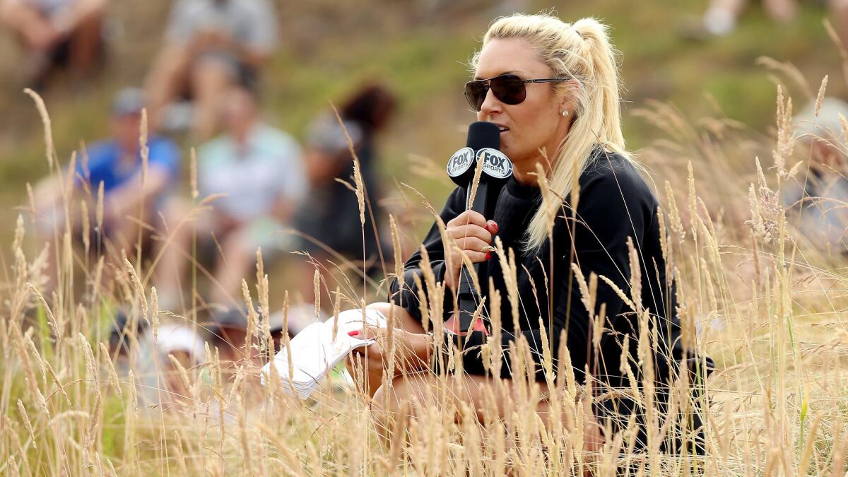 LPGA player Natalie Gulbis reports from the course during Fox Sports' coverage of the 115th U.S. Open at Chambers Bay Golf Course in University Place, Wash., on Thursday.