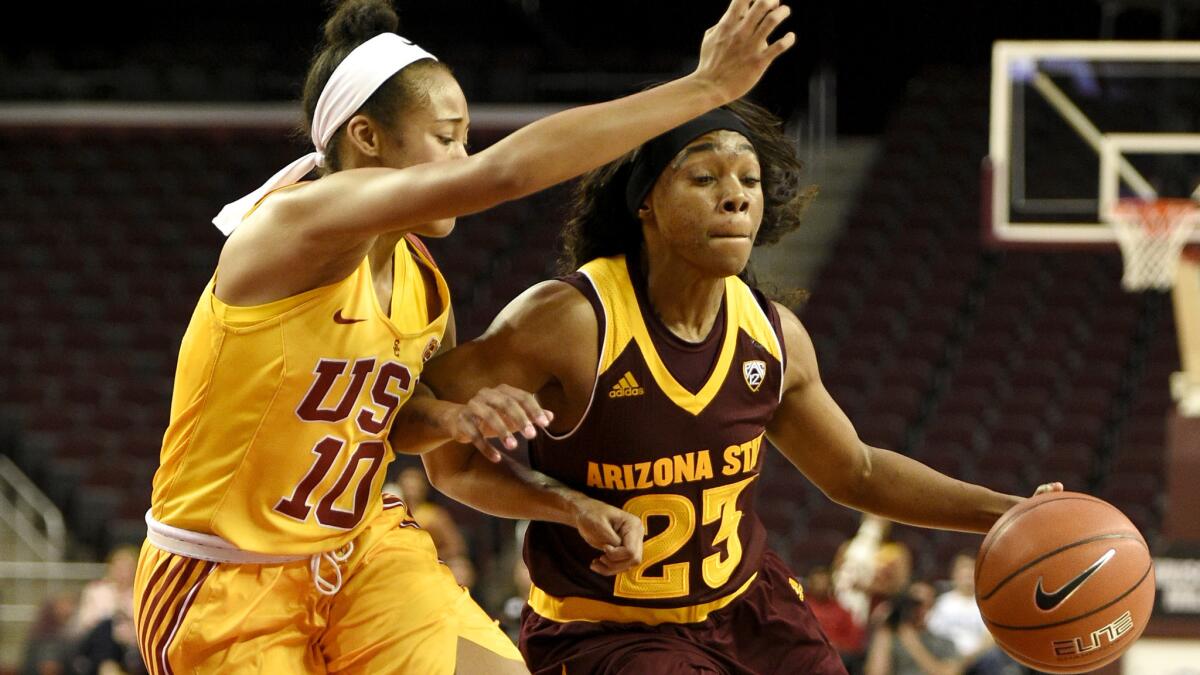 USC guard Courtney Jaco tries to cut off a drive by Arizona State guard Elisha Davis during the first half Friday night.