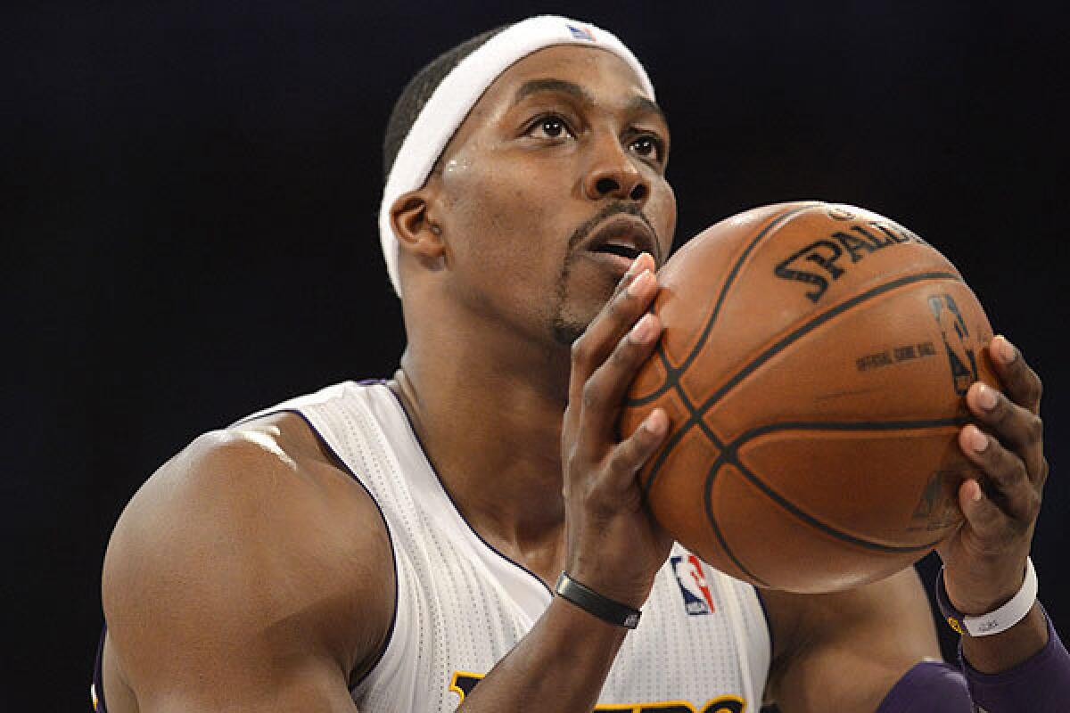 Dwight Howard of the Los Angeles Lakers shoots a free throw during the second half of a game against the Orlando Magic at Staples Center in L.A.