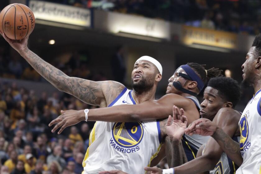 Golden State Warriors center DeMarcus Cousins (0) is fouled by Indiana Pacers center Myles Turner (33) during the first half of an NBA basketball game in Indianapolis, Monday, Jan. 28, 2019. (AP Photo/Michael Conroy)