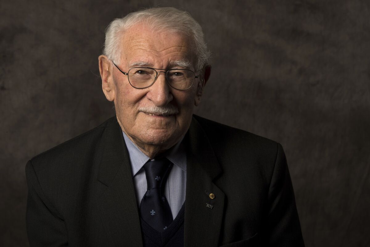 In this undated photo provided by the Sydney Jewish Museum, Holocaust survivor Eddie Jaku poses for a photograph in Sydney, Australia. Jaku, who last year published his best-selling memoir, “The Happiest Man on Earth,” has died in Sydney, a Jewish community leader said. He was 101. (Sydney Jewish Museum via AP)