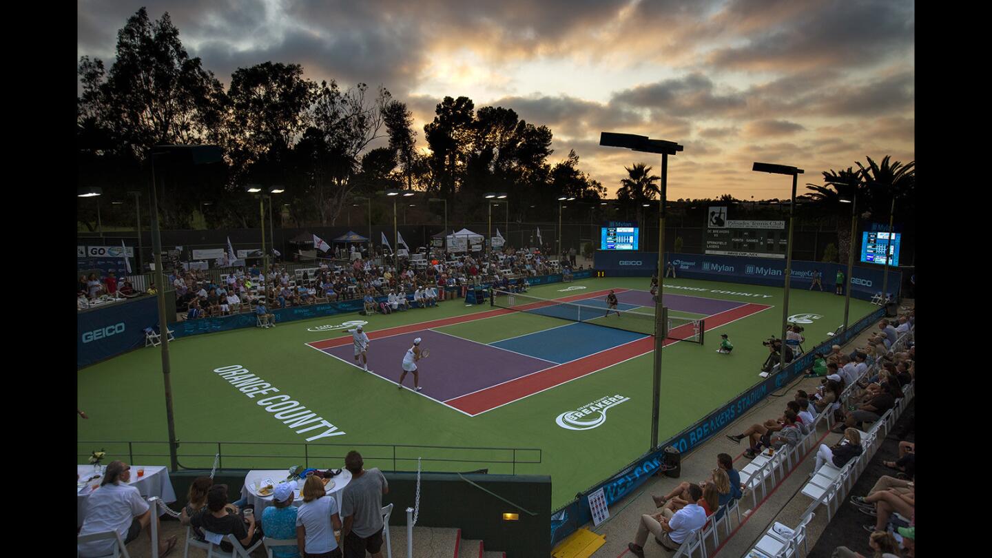 The Orange County Breakers mixed doubles team of Ken Stupski and Andreja Klepac play against the Springfield Lasers mixed doulbe team of Jean-Julien Rojer and Abigail Spears during the opening of the World Team Tennis season at Palisades Tennis Club on Monday, July 17.