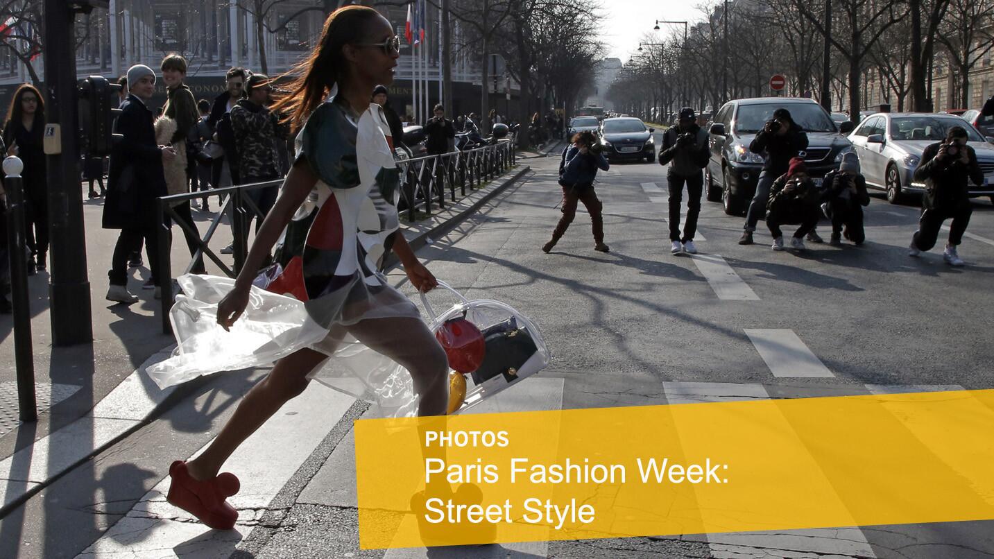 Fashion blogger and stylist Michelle Ellie walks in the street after Miu Miu's show at Paris Fashion Week.