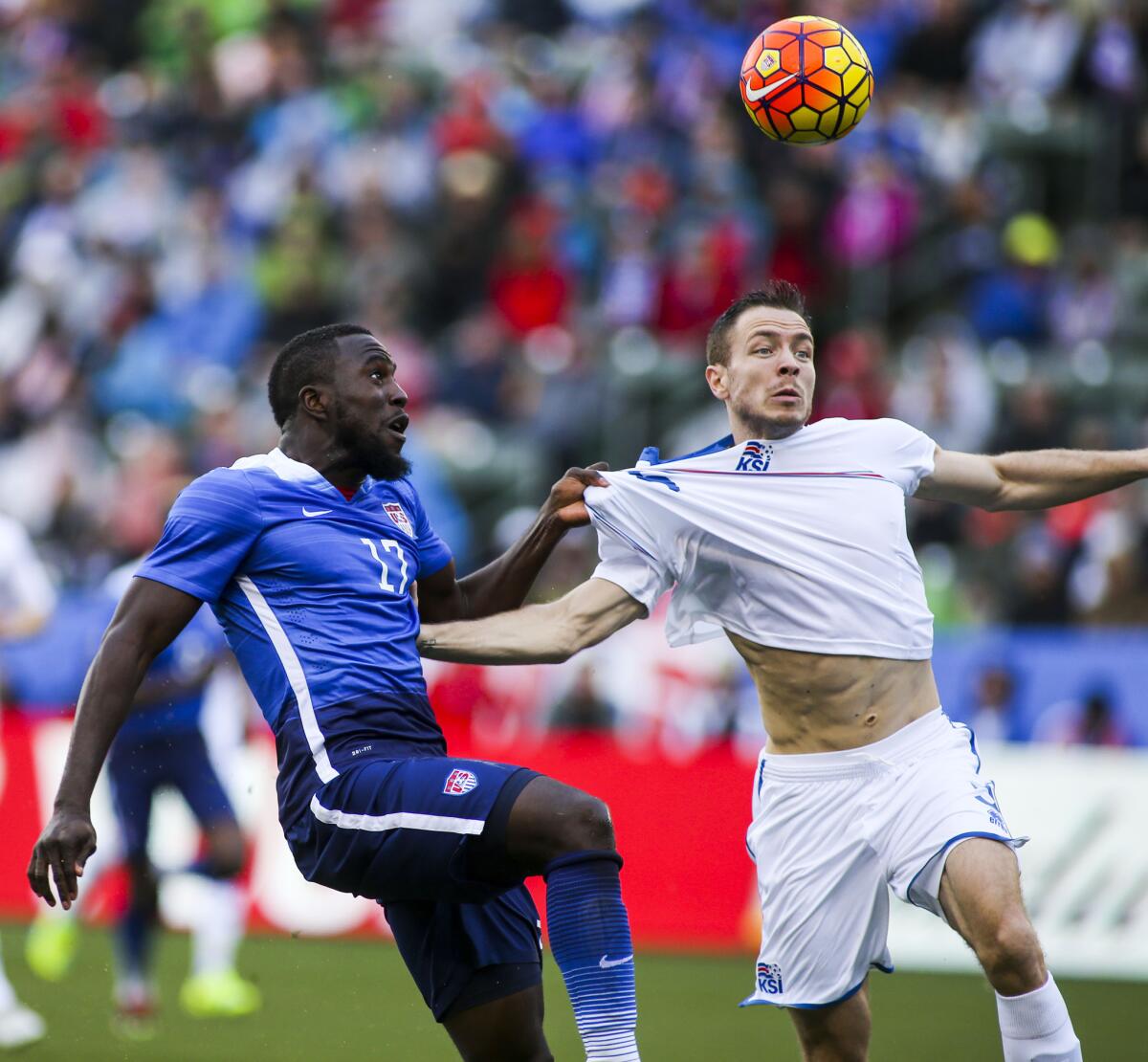 United States forward Jozy Altidore, left, and Iceland defender Jon Gudni Fjoluson battle for the ball in the first half of an international friendly soccer game in Carson, Calif., Sunday, Jan., 31, 2016. (AP Photo/Ringo H.W. Chiu)