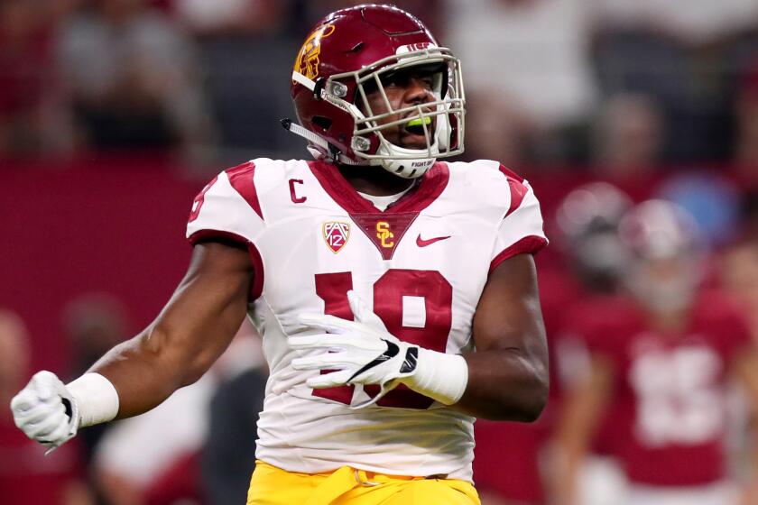 USC linebacker Michael Hutchings celebrates after a play against Alabama in the season opener.