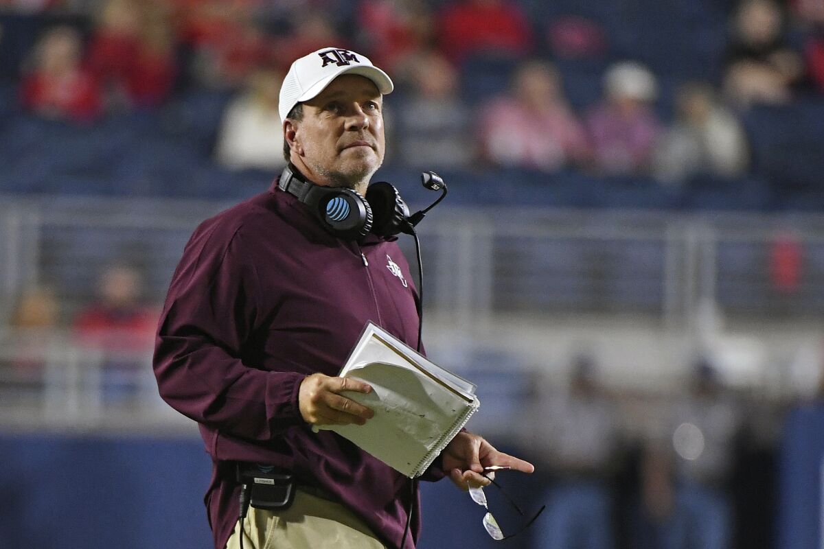 FILE - Texas A&M head coach Jimbo Fisher watches during the first half of an NCAA college football game against Mississippi in Oxford, Miss., Saturday, Oct. 19, 2019. After Texas A&M added yet another blue-chipper to the highest-rated recruiting class in college football Wednesday, Feb. 2, 2022 coach Jimbo Fisher went off about rumors that booster-funded NIL deals were fueling the Aggies' success.(AP Photo/Thomas Graning, File)
