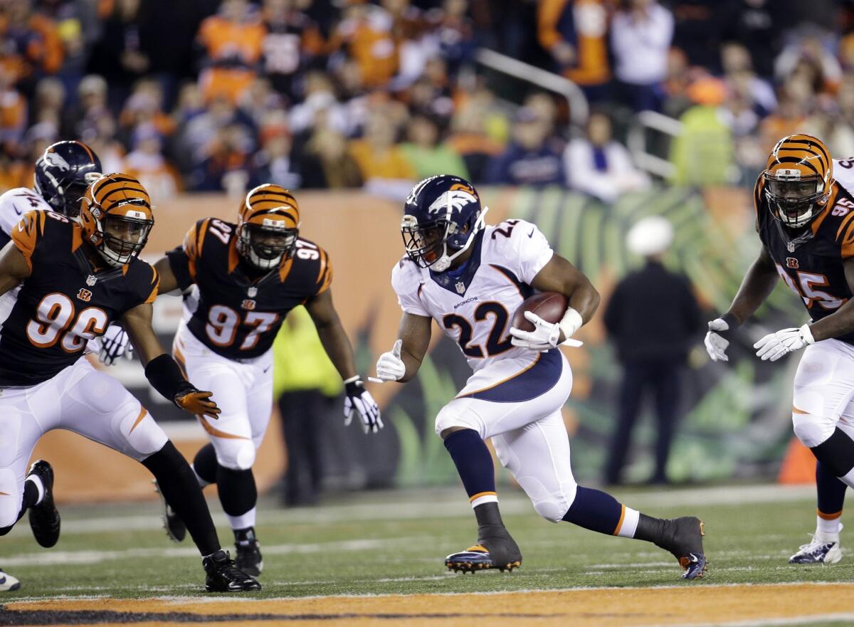 Broncos running back C.J. Anderson (22) runs against the Bengals during the first half of Denver's 37-28 loss Monday to Cincinnati.