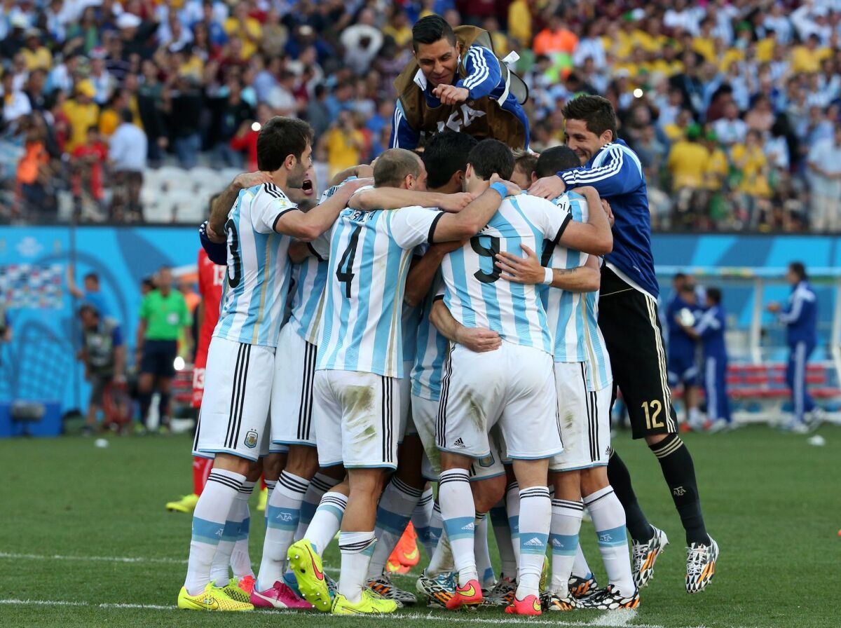 Argentine players celebrate after the FIFA World Cup 2014 round of 16 match between Argentina and Switzerland at the Arena Corinthians in Sao Paulo, Brazil, on Tuesday. Argentina beat Switzerland 1-0.