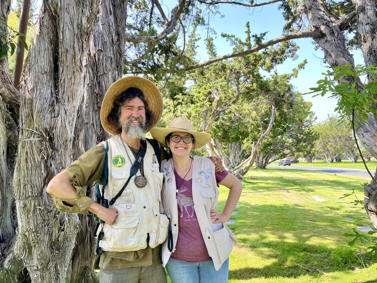 Naturalist Joel Robinson and Fairhaven Memorial Park employee Emily Alvarez.