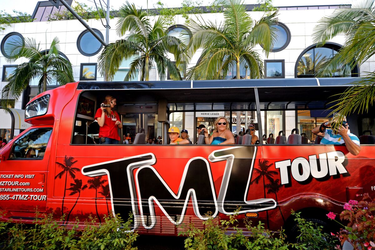 The TMZ tour bus rolls through Rodeo Drive in Beverly Hills.