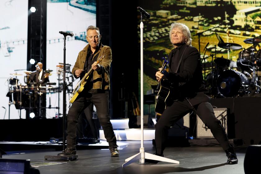 LOS ANGELES, CALIFORNIA - FEBRUARY 02: (L-R) Bruce Springsteen and Honoree Jon Bon Jovi perform during the 2024 MusiCares Person of the Year Honoring Jon Bon Jovi during the 66th GRAMMY Awards on February 02, 2024 in Los Angeles, California. (Photo by Monica Schipper/Getty Images for The Recording Academy)