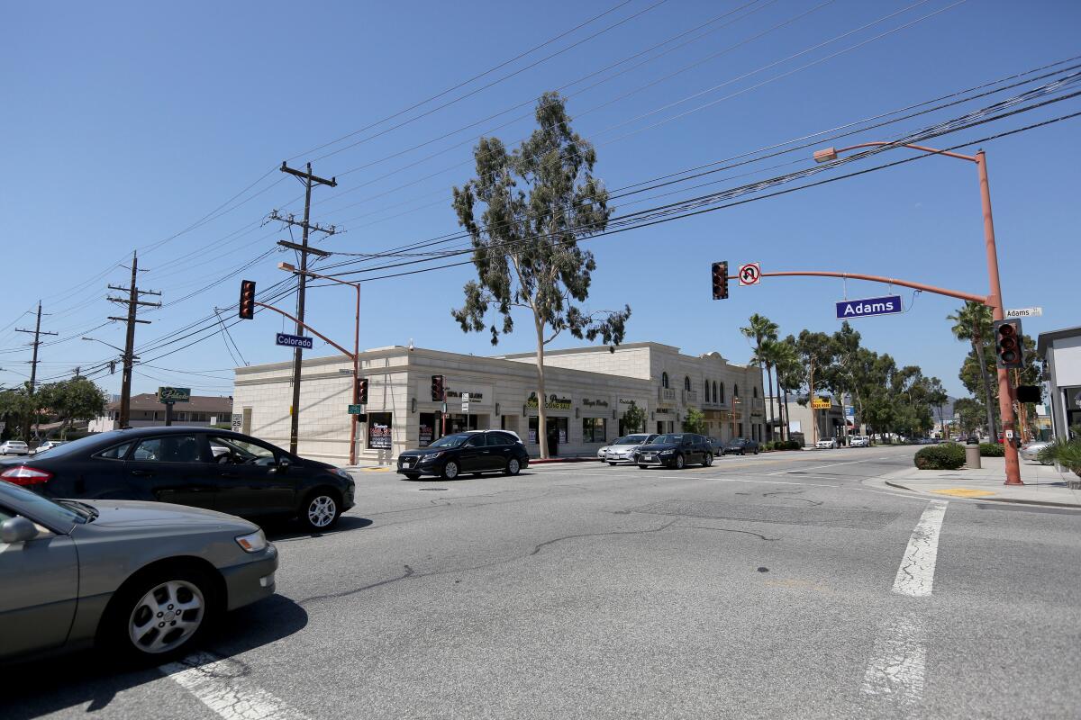 Vehicles cross through the intersection of Colorado Boulevard and Adams Street in Glendale after an outage on Wednesday knocked out power across the city. 