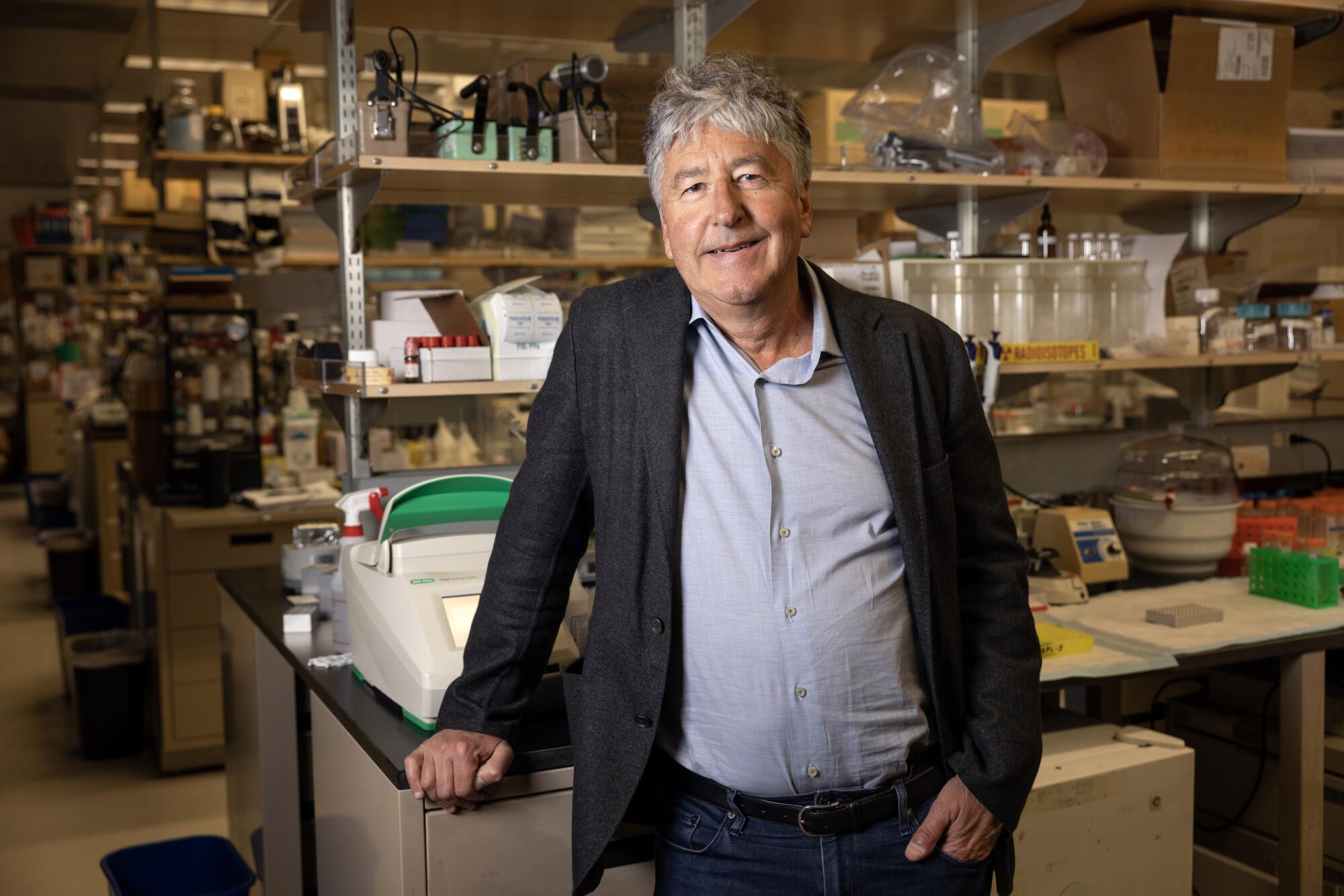 Gerald Joyce stands in a lab at the Salk Institute.