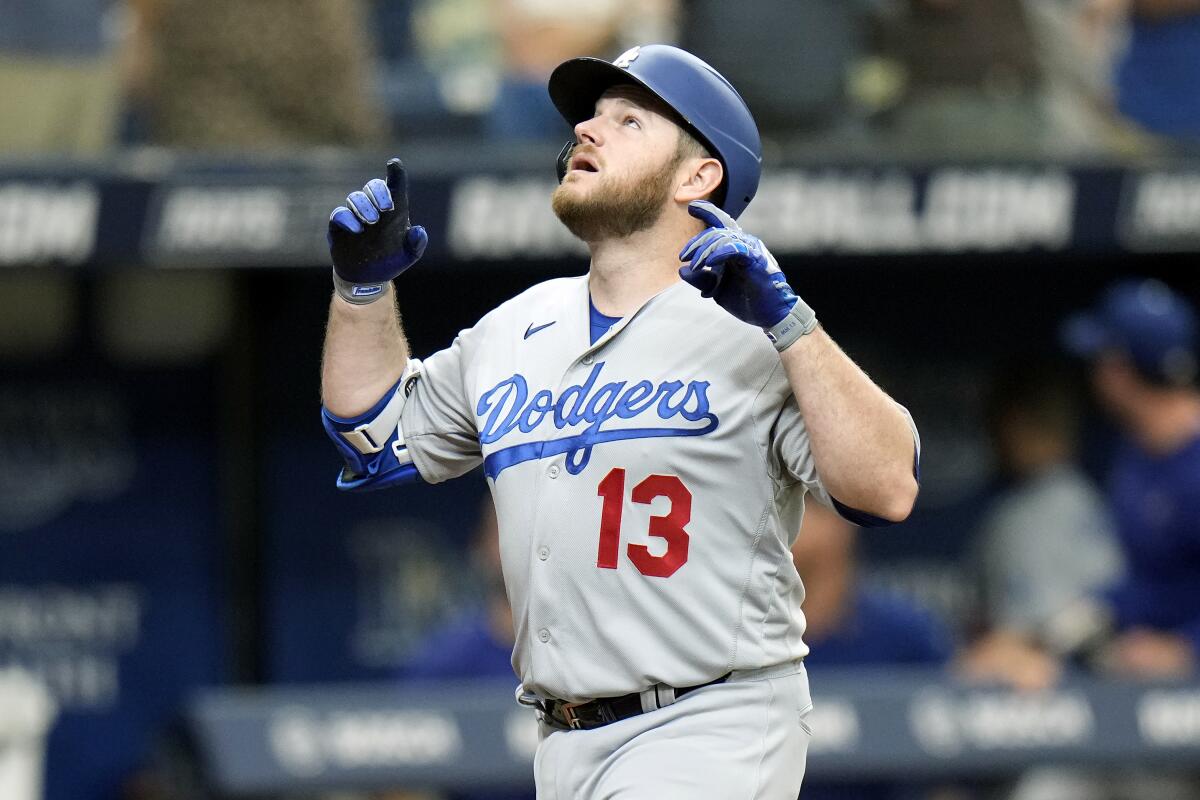 Max Muncy celebrates after hitting a solo home run in the second inning Sunday.