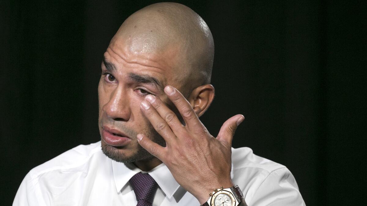 Miguel Cotto wipes away tears during an interview in New York discussing preparations for the final fight of his storied career