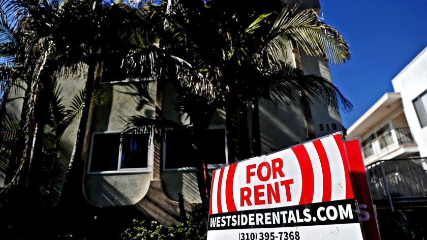 A for rent sign is posted in front of an apartment building on February 1, 2017 in Los Angeles.