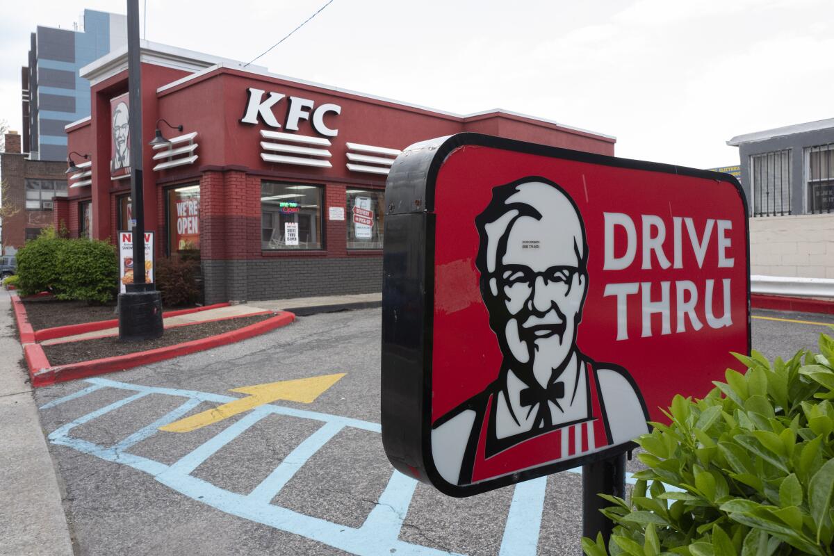 A KFC restaurant is open, Wednesday, April 21, 2021, in New York. Yum Brands’ first-quarter profit more than tripled from a year ago, while sales were bolstered by strong performances from its Pizza Hut and KFC brands in the U.S. The parent company of KFC, Taco Bell and Pizza Hut earned $326 million, or $1.07 per share, for the period ended March 31. (AP Photo/Mark Lennihan)