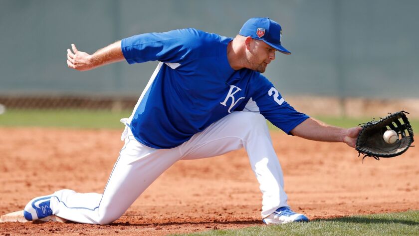 Royals first baseman Lucas Duda fields the ball during a drill before a spring training baseball game against the Cincinnati Reds, Wednesday, Feb. 28, 2018, in Surprise, Ariz.