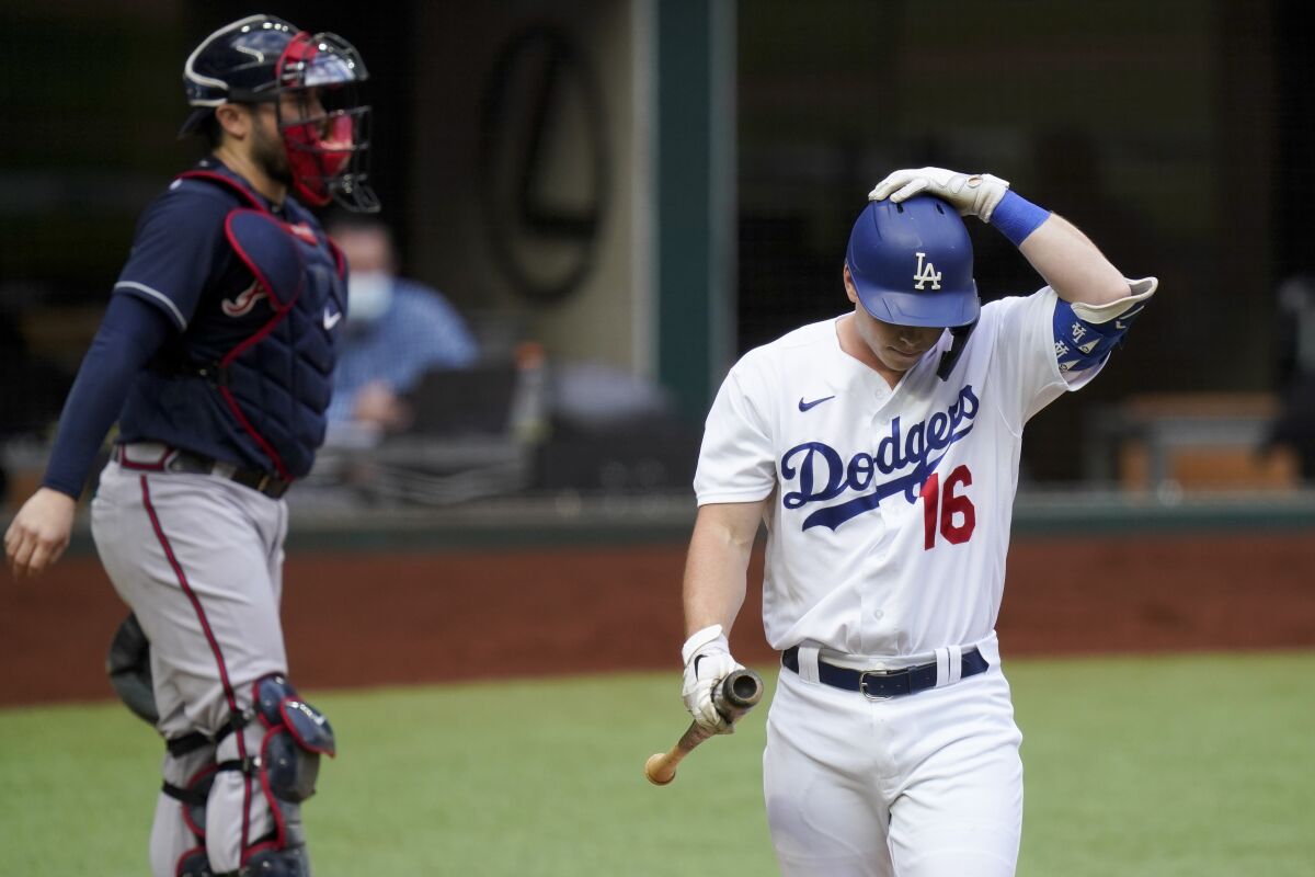 Dodgers catcher Will Smith walks back to the dugout after striking out in the third inning.
