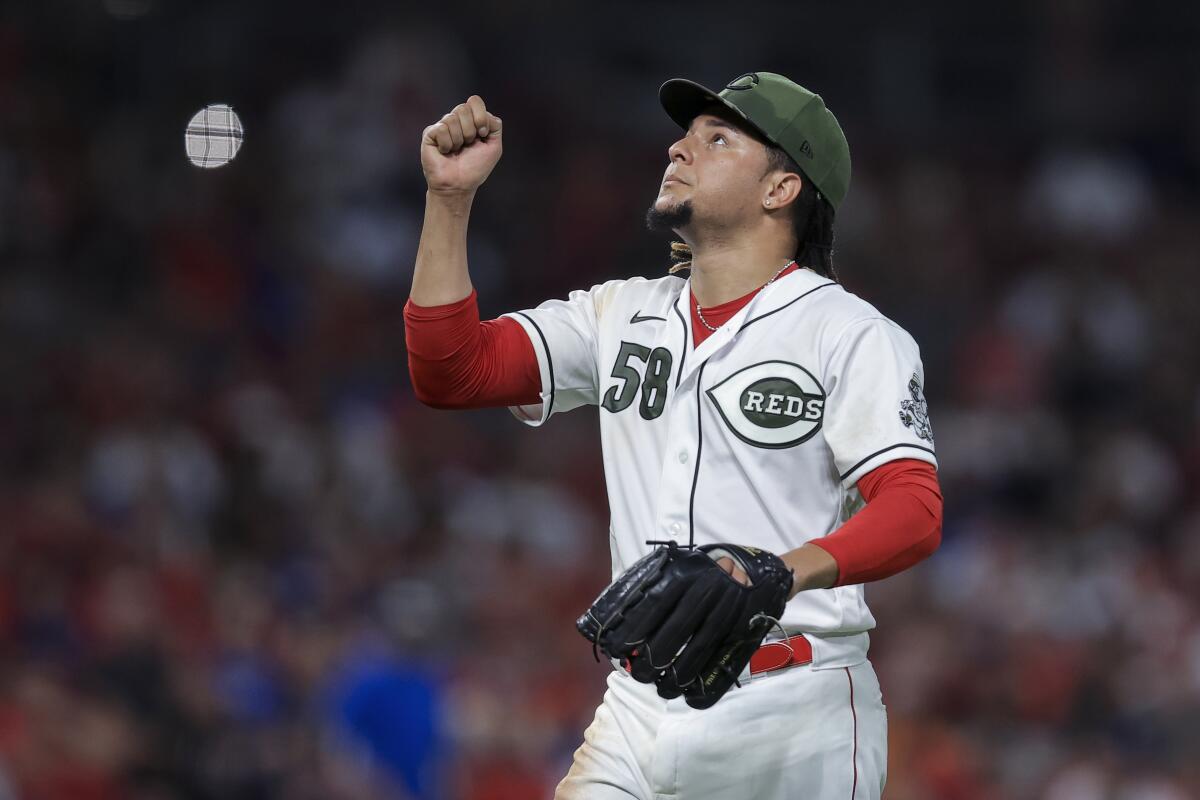 The Reds' Luis Castillo gestures as he leaves during the seventh inning Sept. 17, 2021. 