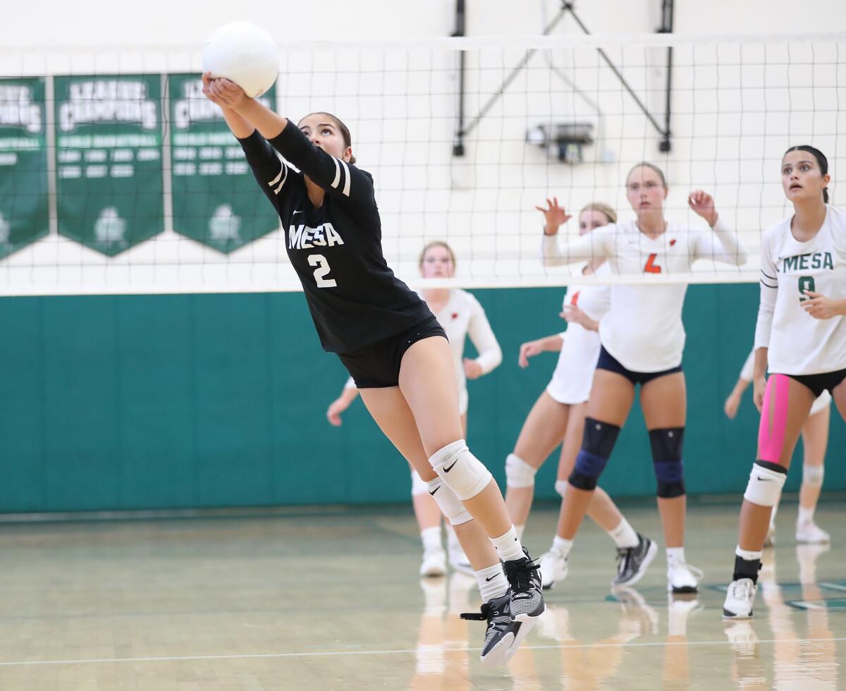 Costa Mesa's Andrea Restrepo (2) makes a diving pass against Pacifica Christian on Thursday.