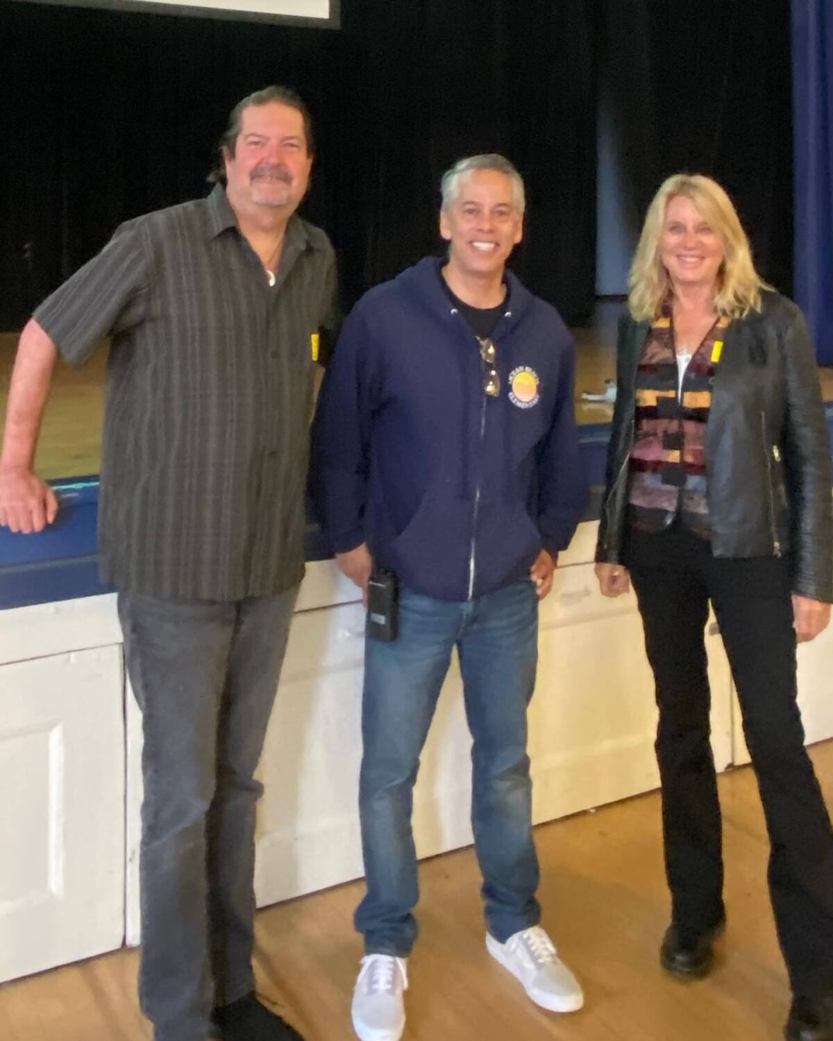 Ocean Beach Elementary School Principal Marco Drapeau (center) with Luminosity's Mike James and Susan Winkie