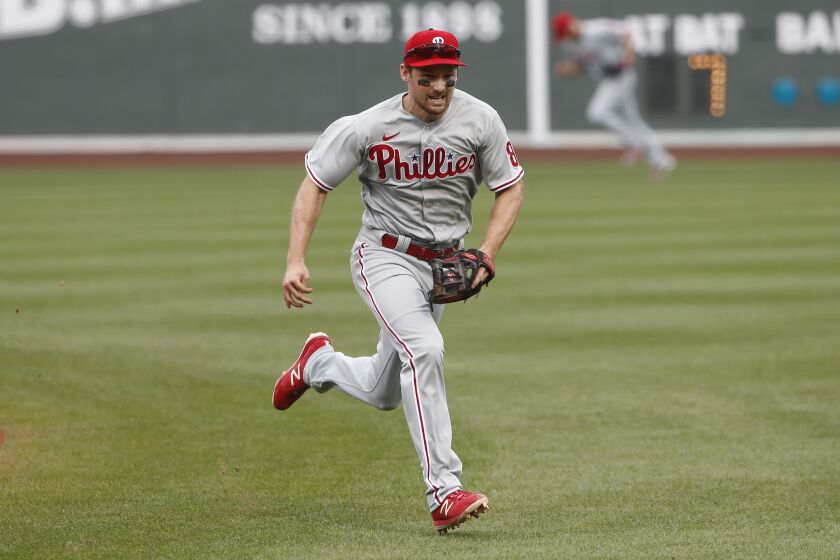 Philadelphia Phillies' Phil Gosselin chases a bloop single during the fifth inning of a baseball game against the Boston Red Sox Wednesday, Aug. 19, 2020, at Fenway Park in Boston. (AP Photo/Winslow Townson)