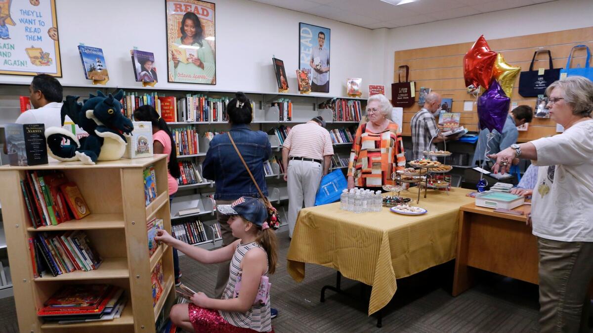 Customers flocked to the grand opening of the Burbank Central Library Friends Bookstore in Burbank on Saturday. The store is run by members of the Friends of the Burbank Public Library. The bookstore is located toward the rear of the library.