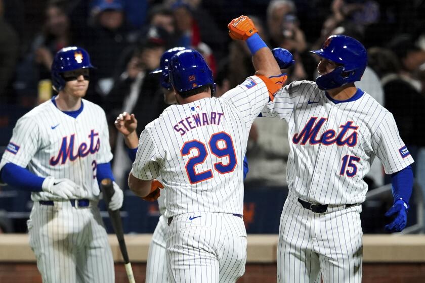 New York Mets' DJ Stewart (29) celebrates with Tyrone Taylor (15) after Stewart hit a three-run home run to score Taylor and J.D. Martinez during the sixth inning of a baseball game against the Chicago Cubs, Tuesday, April 30, 2024, in New York. (AP Photo/Julia Nikhinson)