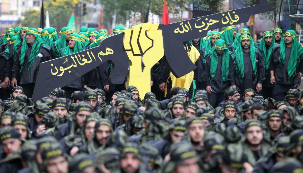 Hezbollah members parade during an Ashura celebration in a Beirut suburb in 2016.