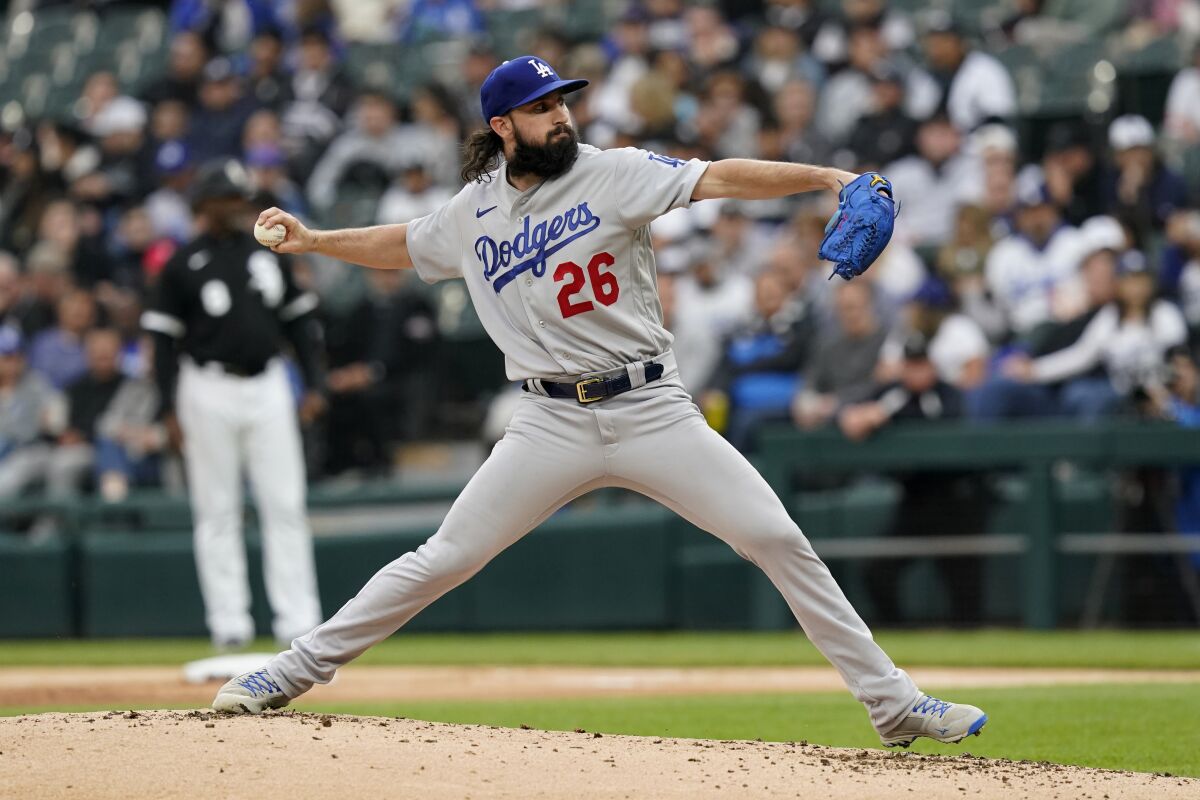 Los Angeles Dodgers starting pitcher Tony Gonsolin delivers to a Chicago White Sox batter during the first inning of a baseball game Wednesday, June 8, 2022, in Chicago. (AP Photo/Charles Rex Arbogast)