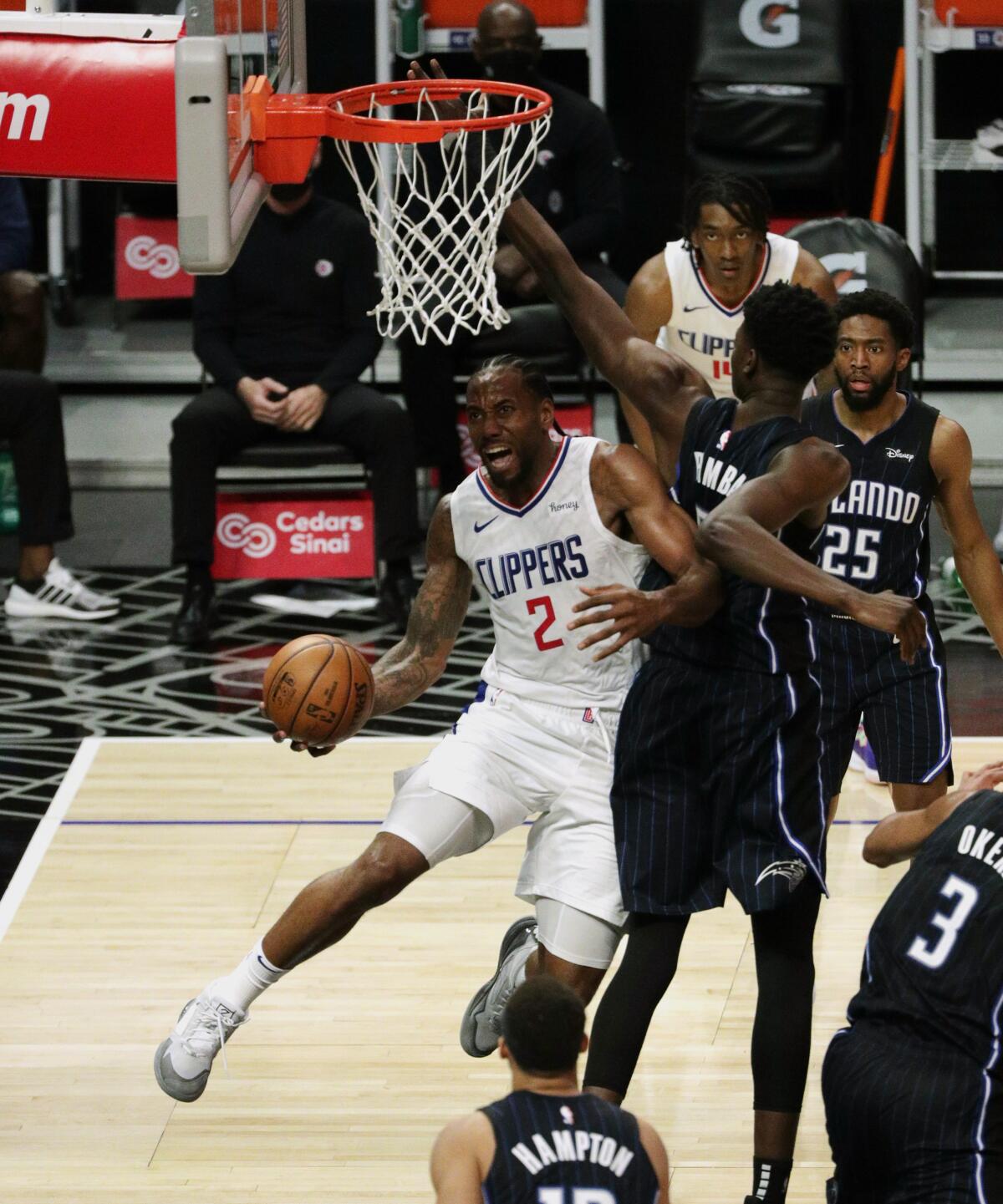 Clippers star Kawhi Leonard drives around Orlando's Mo Bamba.