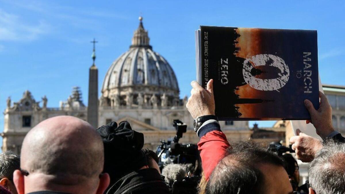 Members of Ending Clergy Abuse protest in St. Peter's Square at the Vatican on Feb. 24.