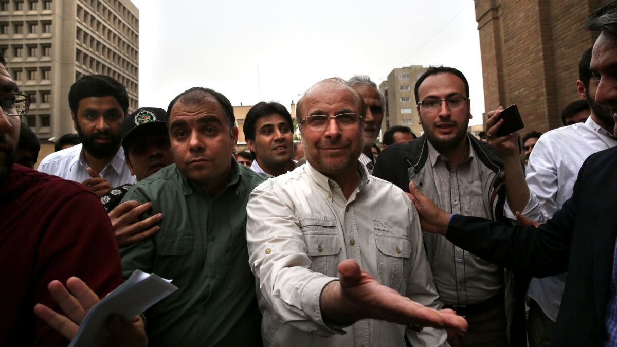 Tehran's mayor Mohammad Bagher Qalibaf, center.