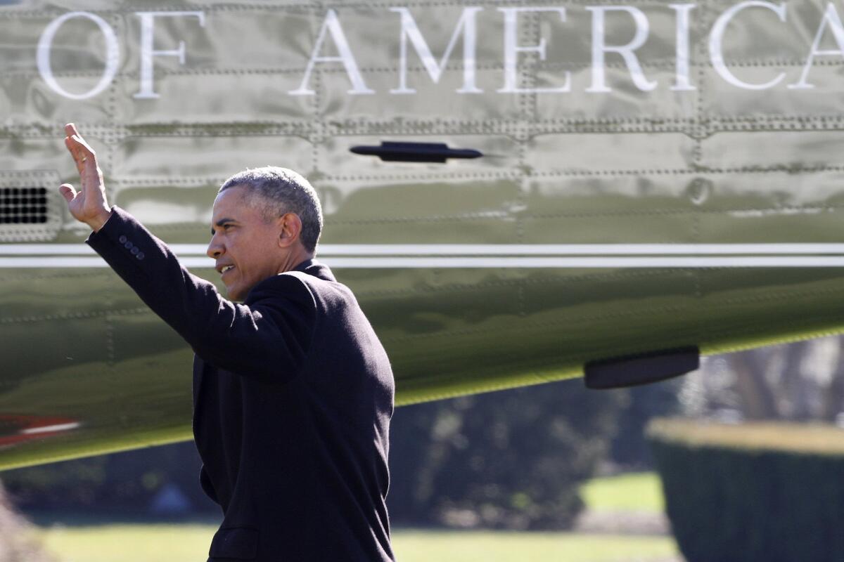 President Barack Obama waves before boarding Marine One helicopter on the South Lawn of the White House on Jan. 13.