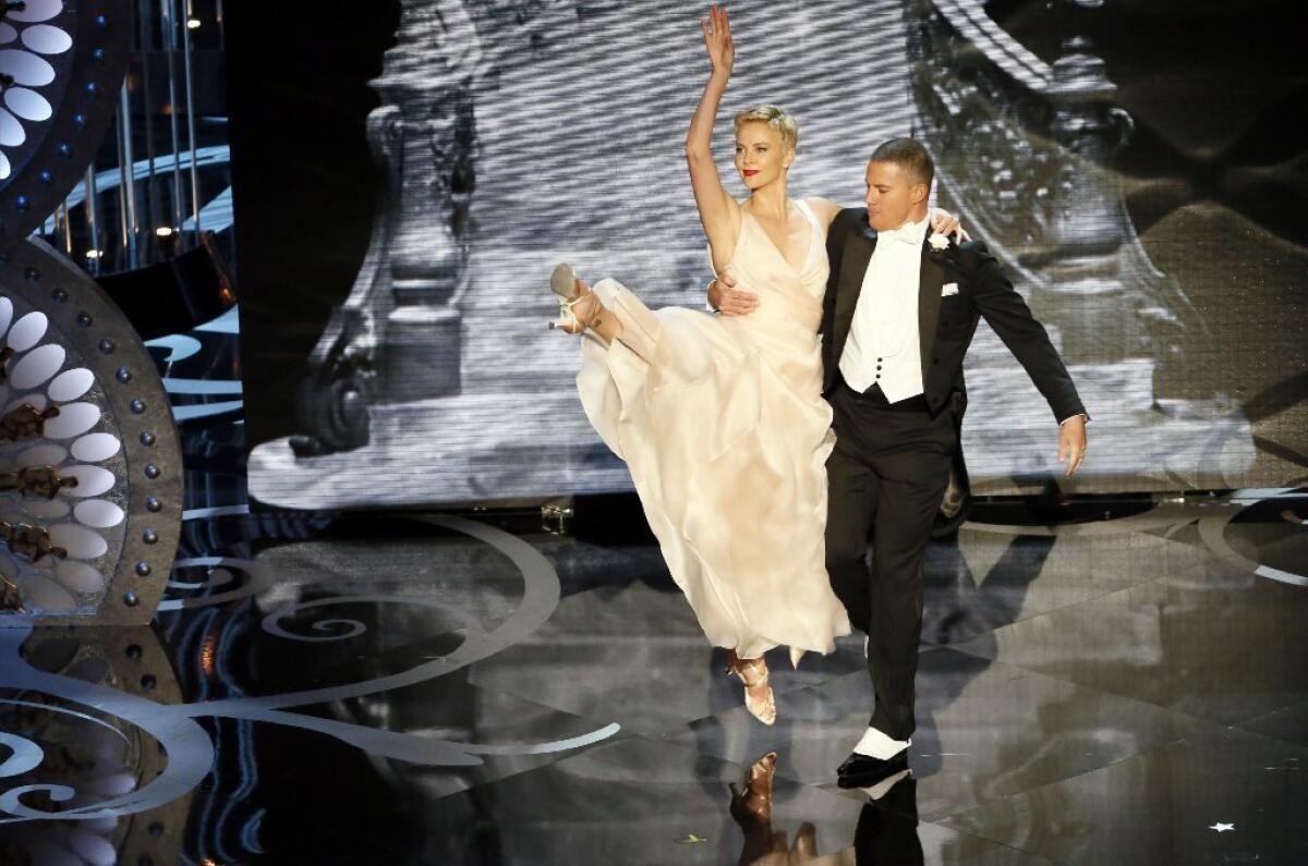 Channing Tatum and Charlize Theron dance on stage during the 85th Academy Awards ceremony.