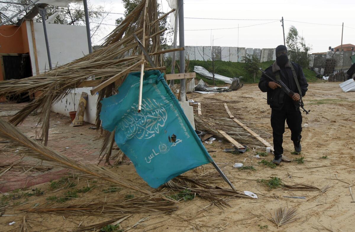 A Hamas-affiliated Palestinian militant walks through a training complex in Khan Yunis in the southern Gaza Strip.