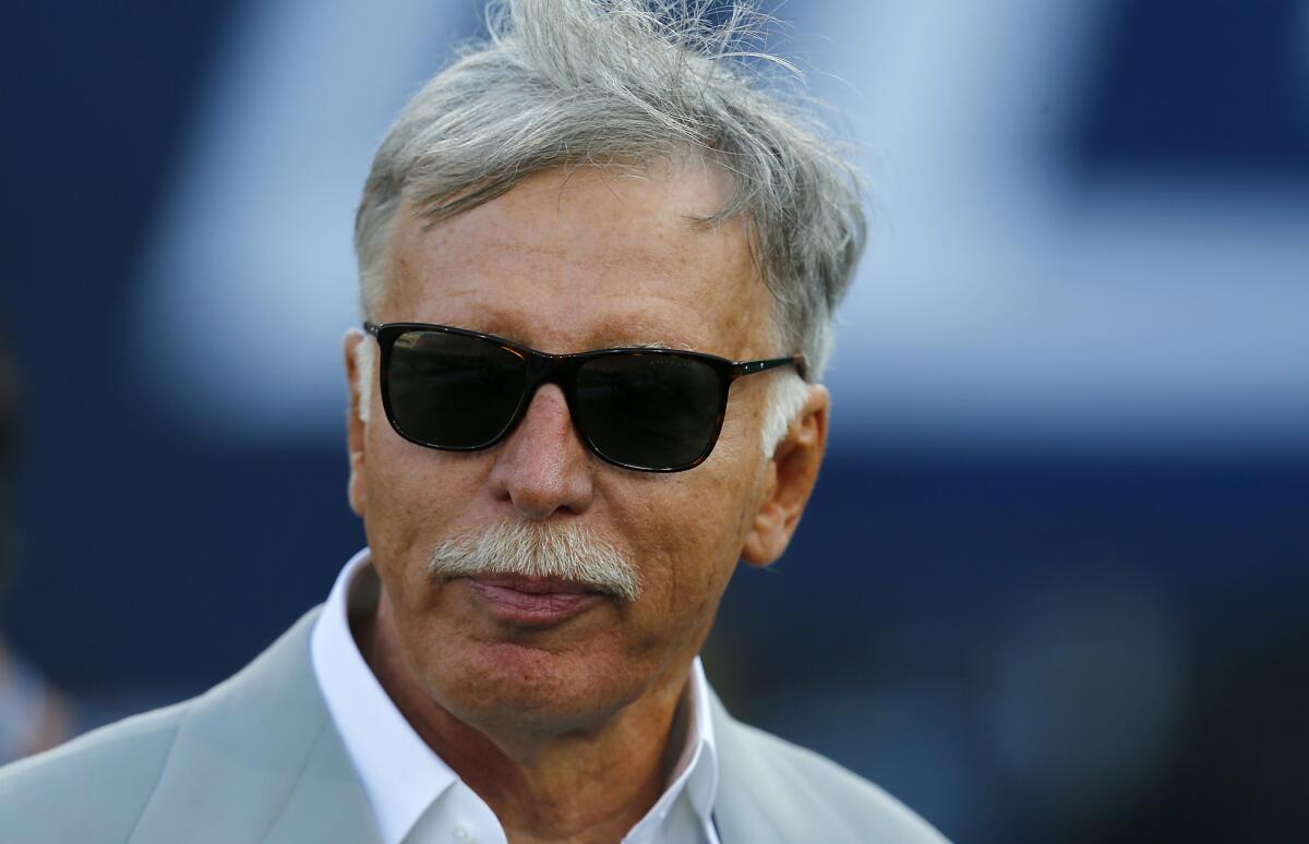 Rams owner Stan Kroenke watches his team warm up before playing Kansas City on Aug. 20.