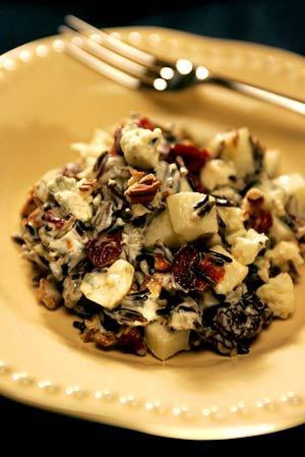 NON-TRADITIONAL: This wild rice salad is made with wild rice, toasted pecans, tart Granny Smith apple and Dijon mustard.