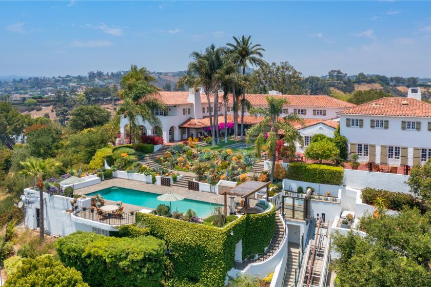 The 3-acre spread includes a 1920s main house, guesthouse, recording studio, movie theater and glass funicular that runs from the pool to the tennis court.